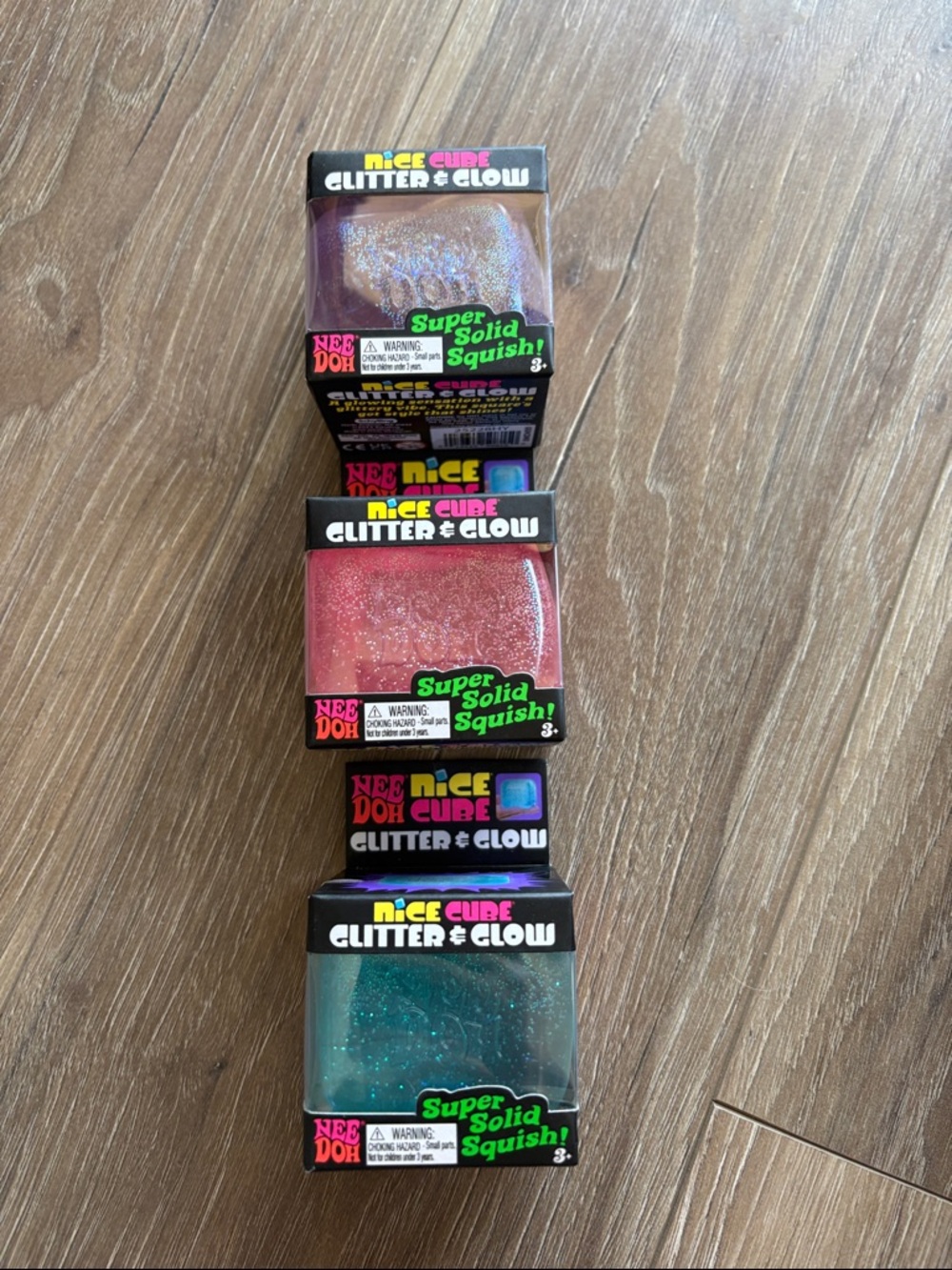 3 Pack NeeDoh Viral Nice Cube Glitter & Glow Squishies - Purple, Pink, Teal